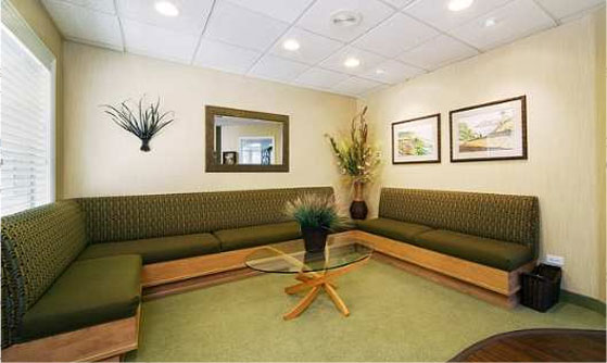 The waiting room of Cruz Orthodontics. The generous seating area is the focus.